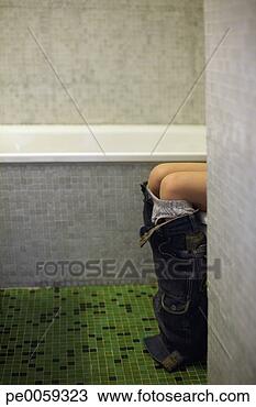 Stock Photo - girl in bathroom 
with only knees 
showing. fotosearch 
- search stock 
photos, pictures, 
images, and photo 
clipart