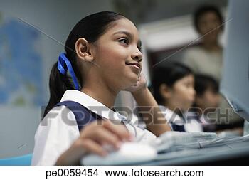Stock Photo - girl at computer 
in classroom with 
other students 
in background. 
fotosearch - search 
stock photos, 
pictures, images, 
and photo clipart