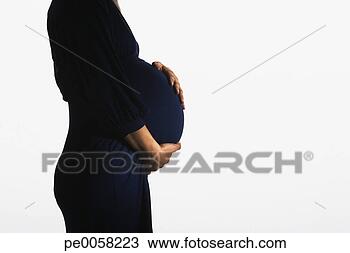 Stock Photo - woman holding 
her pregnant stomach. 
fotosearch - search 
stock photos, 
pictures, images, 
and photo clipart