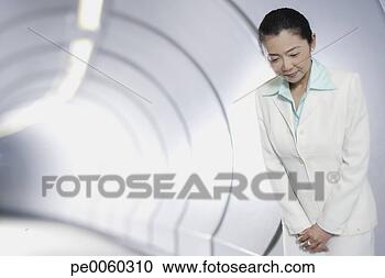 Stock Photography - businesswoman 
in corridor bowing 
at camera. fotosearch 
- search stock 
photos, pictures, 
images, and photo 
clipart