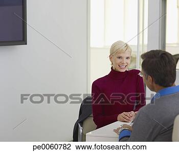 Stock Photo - two businesspeople 
in boardroom working. 
fotosearch - search 
stock photos, 
pictures, images, 
and photo clipart