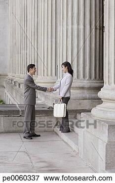 Picture - two businesspeople 
outdoors on steps 
shaking hands. 
fotosearch - search 
stock photos, 
pictures, images, 
and photo clipart