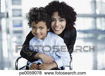 Stock Photo - woman and young 
boy in airport 
being affectionate. 
fotosearch - search 
stock photos, 
pictures, images, 
and photo clipart