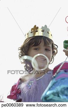 Stock Photograph - young girl in 
party hat and 
costume playing 
with bubbles. 
fotosearch - search 
stock photos, 
pictures, images, 
and photo clipart