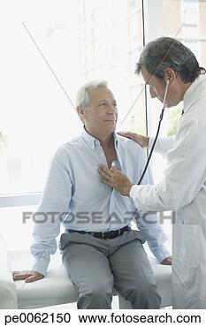 Stock Photography - doctor in hospital 
room with patient 
using stethoscope. 
fotosearch - search 
stock photos, 
pictures, images, 
and photo clipart