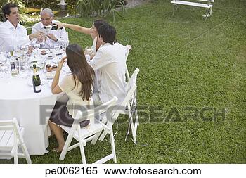 Stock Image - five people at 
outdoor party 
socially drinking. 
fotosearch - search 
stock photos, 
pictures, images, 
and photo clipart
