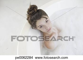 Stock Photo - woman relaxing 
in bubble bath. 
fotosearch - search 
stock photos, 
pictures, images, 
and photo clipart