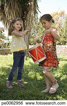 Stock Photo - two girls playing 
musical instruments. 
fotosearch - search 
stock photos, 
pictures, images, 
and photo clipart