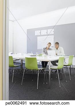 Stock Photography - business people 
working in conference 
room. fotosearch 
- search stock 
photos, pictures, 
images, and photo 
clipart
