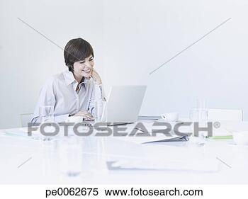 Stock Image - businesswoman 
working at conference 
table. fotosearch 
- search stock 
photos, pictures, 
images, and photo 
clipart