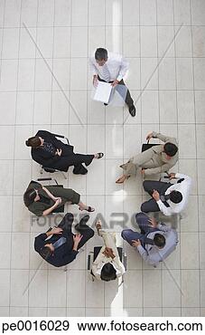 Stock Photograph - aerial view of 
businessman presenting 
to group of businesspeople. 
fotosearch - search 
stock photos, 
pictures, images, 
and photo clipart