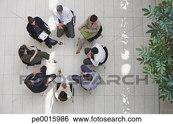 Stock Photo - aerial view of 
businesspeople 
sitting in circle 
with documents. 
fotosearch - search 
stock photos, 
pictures, images, 
and photo clipart