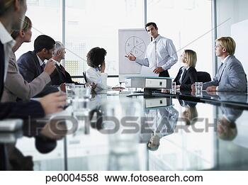Stock Photo - group of office 
workers in a boardroom 
presentation. 
fotosearch - search 
stock photos, 
pictures, images, 
and photo clipart