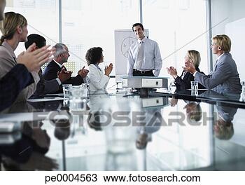 Stock Photo - group of office 
workers in a boardroom 
presentation. 
fotosearch - search 
stock photos, 
pictures, images, 
and photo clipart