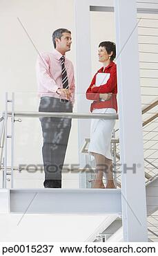 Picture - businessman and 
businesswoman 
on staircase. 
fotosearch - search 
stock photos, 
pictures, images, 
and photo clipart