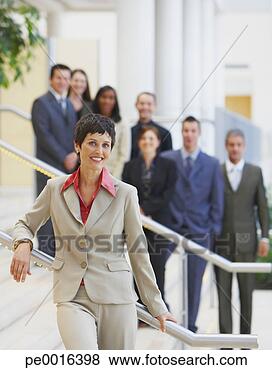 Stock Photo - businesswoman 
on stairs with 
group of businesspeople. 
fotosearch - search 
stock photos, 
pictures, images, 
and photo clipart