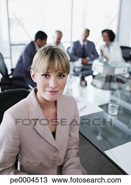 Stock Photo - woman and office 
colleagues in 
a boardroom meeting. 
fotosearch - search 
stock photos, 
pictures, images, 
and photo clipart