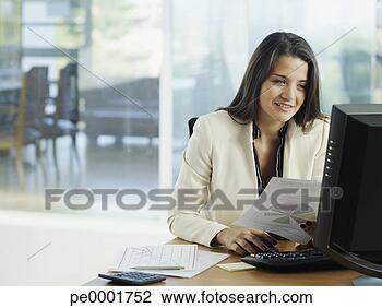 Stock Photo - woman in office 
working on her 
personal computer. 
fotosearch - search 
stock photos, 
pictures, images, 
and photo clipart