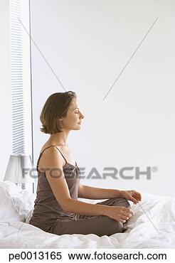 Stock Image - woman doing yoga. 
fotosearch - search 
stock photos, 
pictures, images, 
and photo clipart