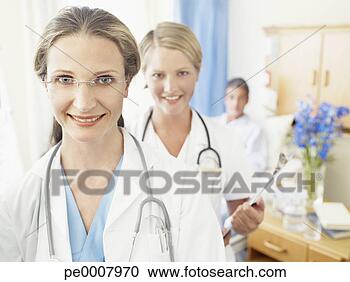 Stock Photography - female doctor 
and nurse in hospital 
room. fotosearch 
- search stock 
photos, pictures, 
images, and photo 
clipart