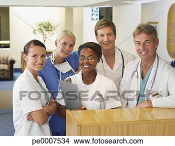Stock Photo - nurses and doctors 
standing and smiling. 
fotosearch - search 
stock photos, 
pictures, images, 
and photo clipart
