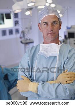 Stock Photo - surgeon in operating 
room in scrubs 
with arms crossed. 
fotosearch - search 
stock photos, 
pictures, images, 
and photo clipart