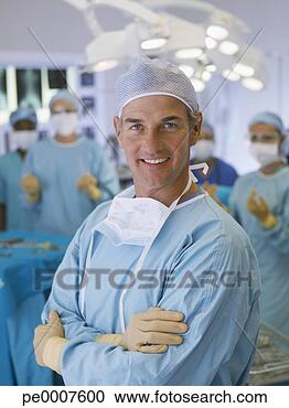 Stock Photography - surgeon in operating 
room in scrubs 
with arms crossed. 
fotosearch - search 
stock photos, 
pictures, images, 
and photo clipart