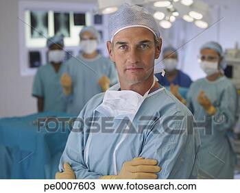 Stock Photo - surgeon in operating 
room in scrubs 
with arms crossed. 
fotosearch - search 
stock photos, 
pictures, images, 
and photo clipart