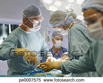 Stock Image - team of nurses 
and surgeons in 
surgery. fotosearch 
- search stock 
photos, pictures, 
images, and photo 
clipart