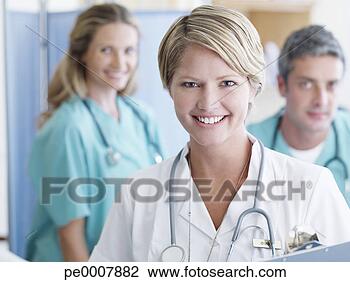 Stock Photo - three hospital 
workers smiling. 
fotosearch - search 
stock photos, 
pictures, images, 
and photo clipart