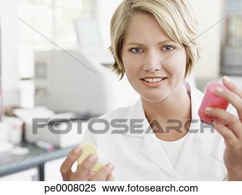 Stock Image - woman holding 
lab samples. fotosearch 
- search stock 
photos, pictures, 
images, and photo 
clipart