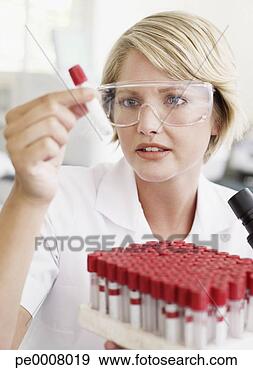 Stock Photograph - woman looking 
at test tubes. 
fotosearch - search 
stock photos, 
pictures, images, 
and photo clipart