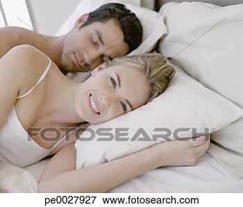 man woman in bed