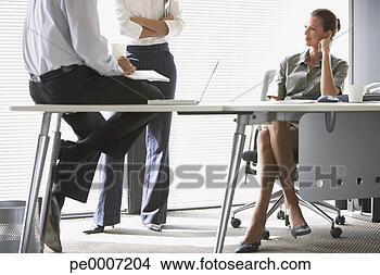 Stock Photo - three colleagues 
meeting. fotosearch 
- search stock 
photos, pictures, 
images, and photo 
clipart