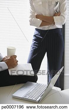 Stock Photo - two business colleagues 
talking. fotosearch 
- search stock 
photos, pictures, 
images, and photo 
clipart