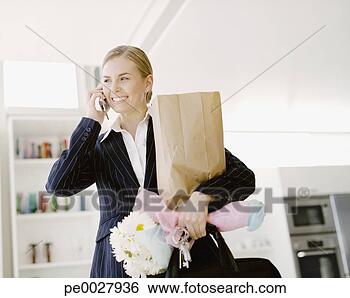 Stock Photo - woman on cell 
phone with shopping 
bag and daisies. 
fotosearch - search 
stock photos, 
pictures, images, 
and photo clipart