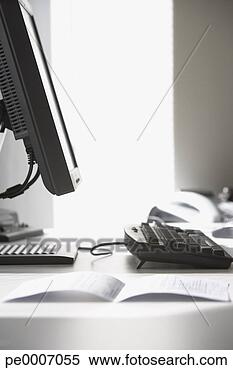 Stock Image - detailed view 
of document on 
desk with computer. 
fotosearch - search 
stock photos, 
pictures, images, 
and photo clipart