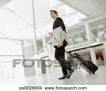 Stock Photo - male business 
traveler. fotosearch 
- search stock 
photos, pictures, 
images, and photo 
clipart