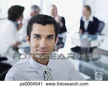 Stock Photography - man and office 
colleagues in 
a boardroom meeting. 
fotosearch - search 
stock photos, 
pictures, images, 
and photo clipart