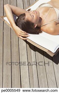 Stock Photograph - woman sunbathing. 
fotosearch - search 
stock photos, 
pictures, images, 
and photo clipart