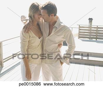 Stock Photo - couple embracing 
outdoors. fotosearch 
- search stock 
photos, pictures, 
images, and photo 
clipart