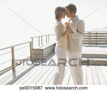 Picture - couple holding 
hands outdoors. 
fotosearch - search 
stock photos, 
pictures, images, 
and photo clipart