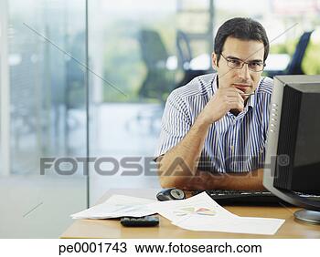 Stock Photo - man in office 
working on personal 
computer. fotosearch 
- search stock 
photos, pictures, 
images, and photo 
clipart