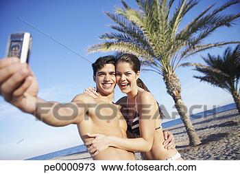Banco de Imagem - par,  praia,  
levando,  quadro, 
 sees,  câmera, 
 telefone. fotosearch 
- busca de fotos, 
imagens e clipart