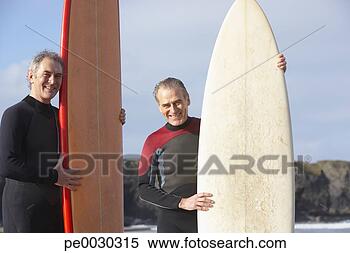 Banco de Imagem - dois,  men,  segurando, 
 surfboards. fotosearch 
- busca de fotos, 
imagens e clipart