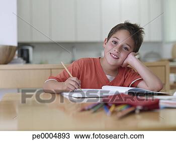 Stock Photo - boy sitting with 
homework smiling. 
fotosearch - search 
stock photos, 
pictures, images, 
and photo clipart