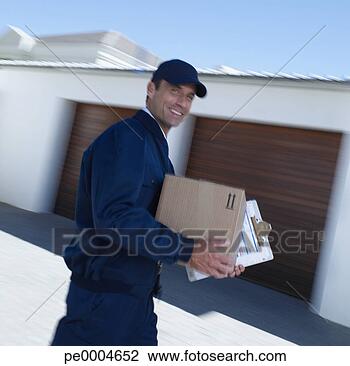 Stock Photo - delivery person 
with package motion 
blur. fotosearch 
- search stock 
photos, pictures, 
images, and photo 
clipart