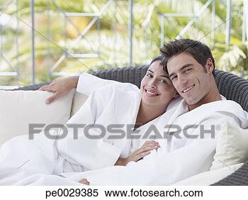 Stock Image - a couple relaxing 
in bathrobes. 
fotosearch - search 
stock photos, 
pictures, images, 
and photo clipart