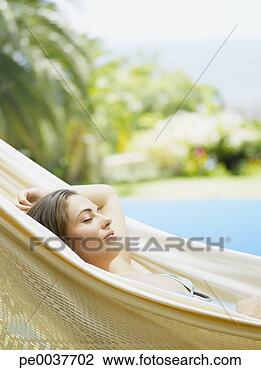 Stock Photo - woman relaxing 
in a hammock. 
fotosearch - search 
stock photos, 
pictures, images, 
and photo clipart