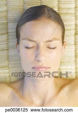 Stock Image - woman relaxing 
on a massage table. 
fotosearch - search 
stock photos, 
pictures, images, 
and photo clipart